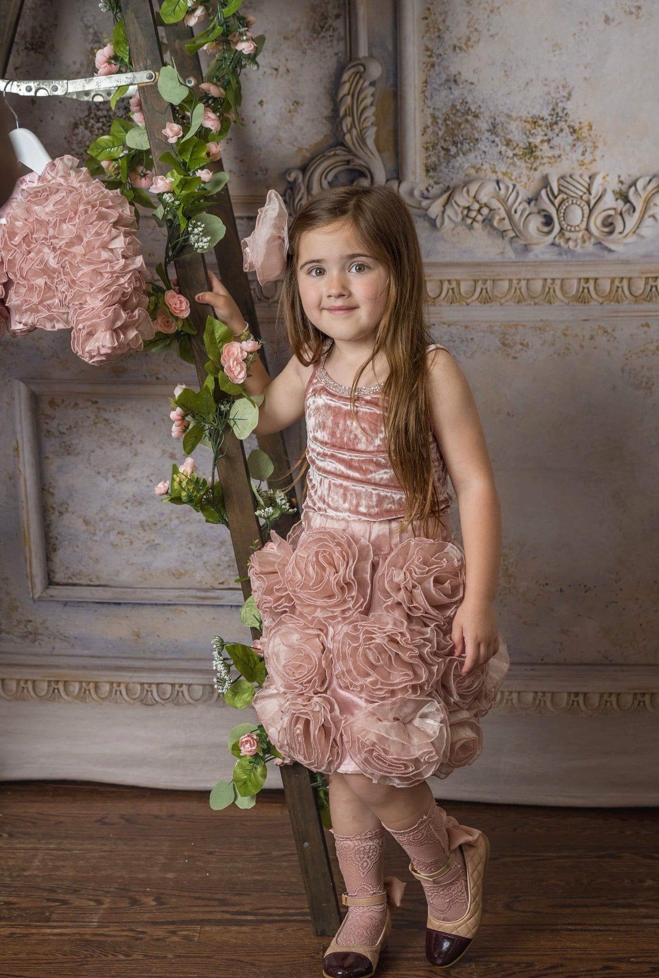 Girls blush pink velvet camisole top with rhinestone trim paired with matching blush pink skirt with flower details