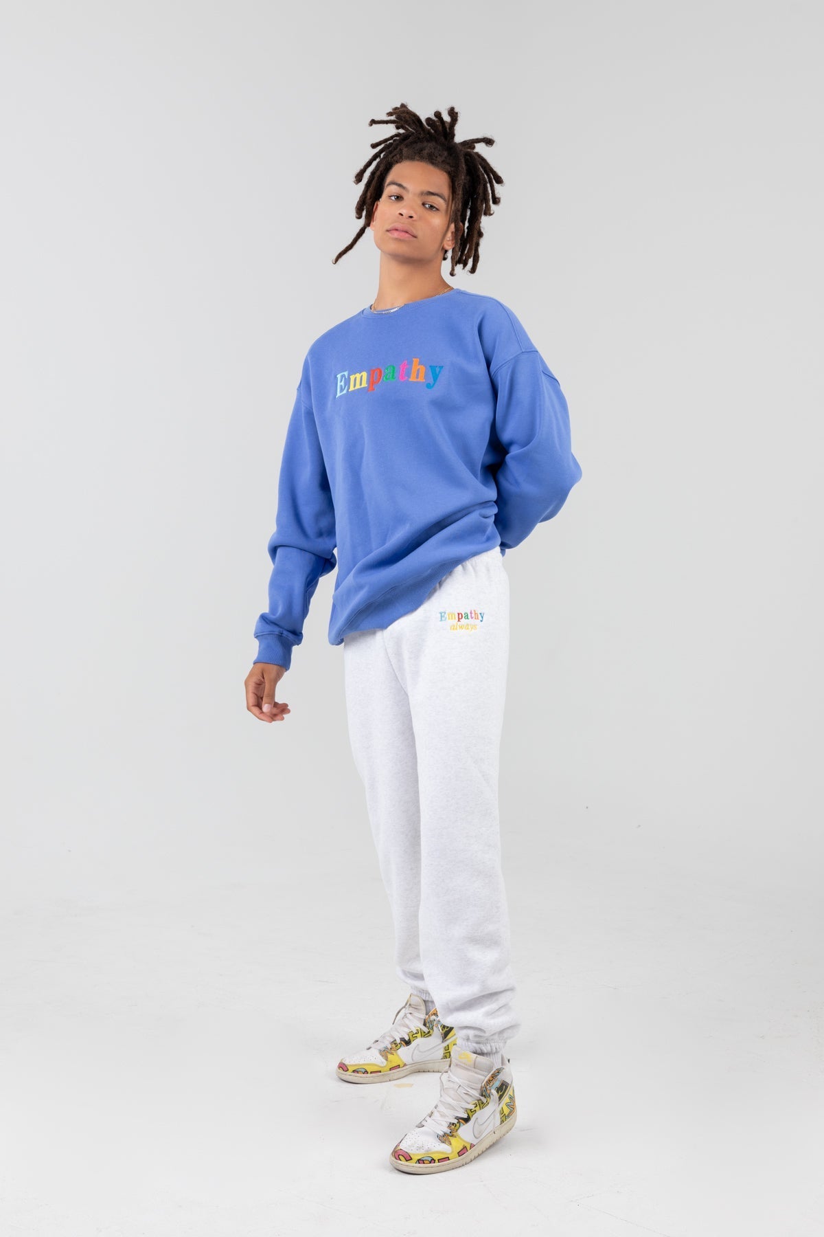 Man in blue empathy crewneck