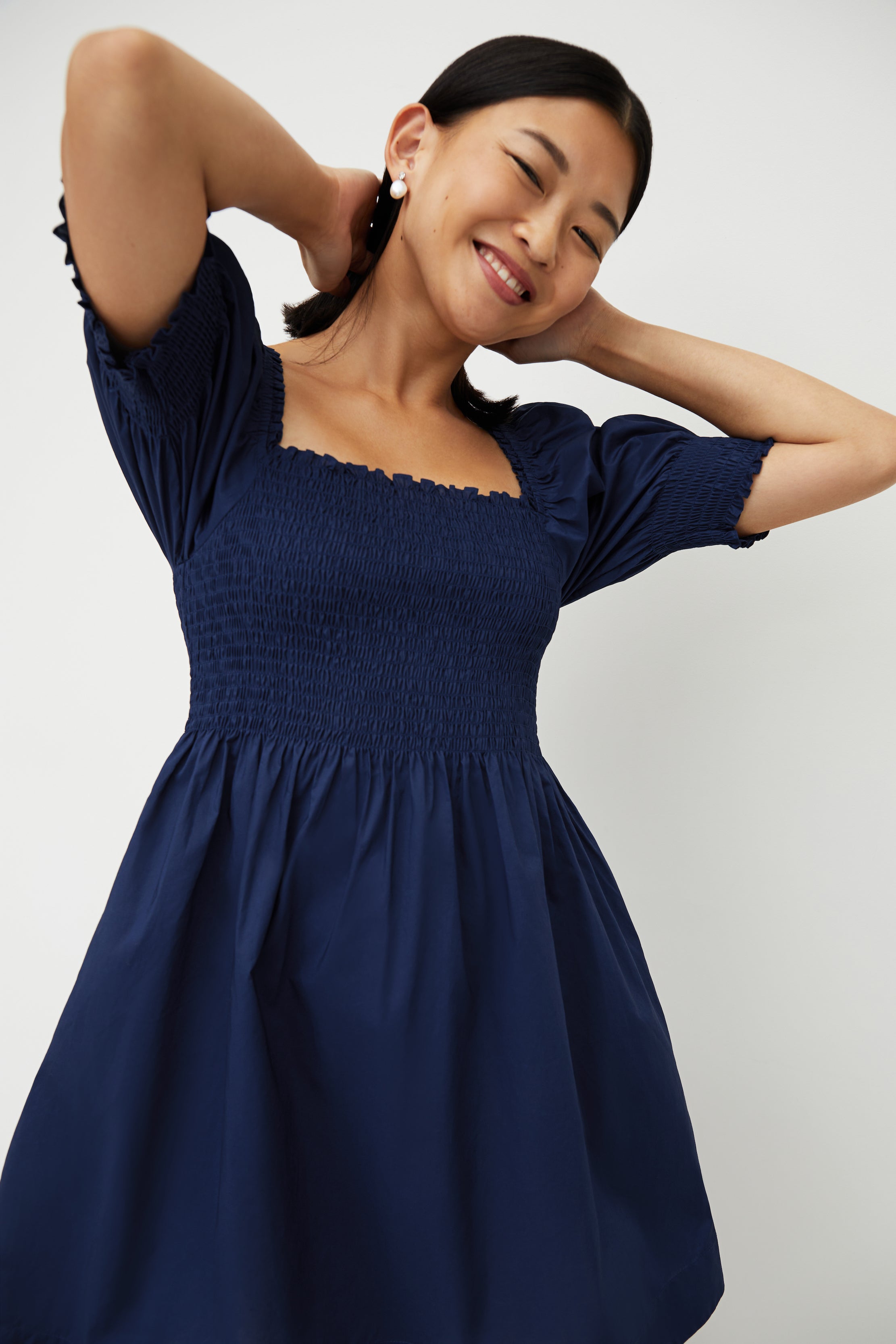 Sophia wears a size XS in the Navy Crepe color:Wrinkle Resistant Navy Crepe
