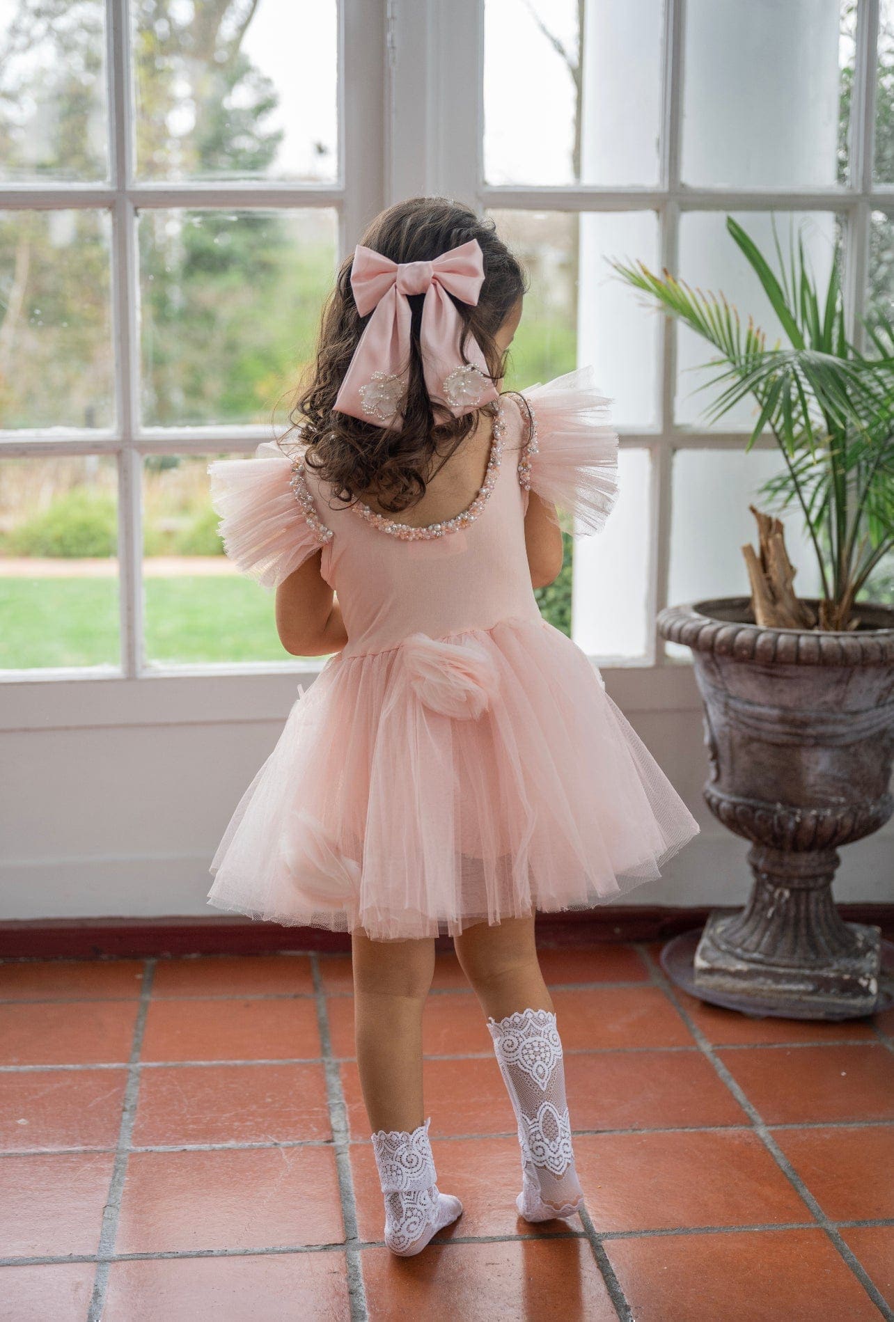 Young girl wearing Ballet pink Anise Satin Embroidered Hair Bow with pearl embellishment