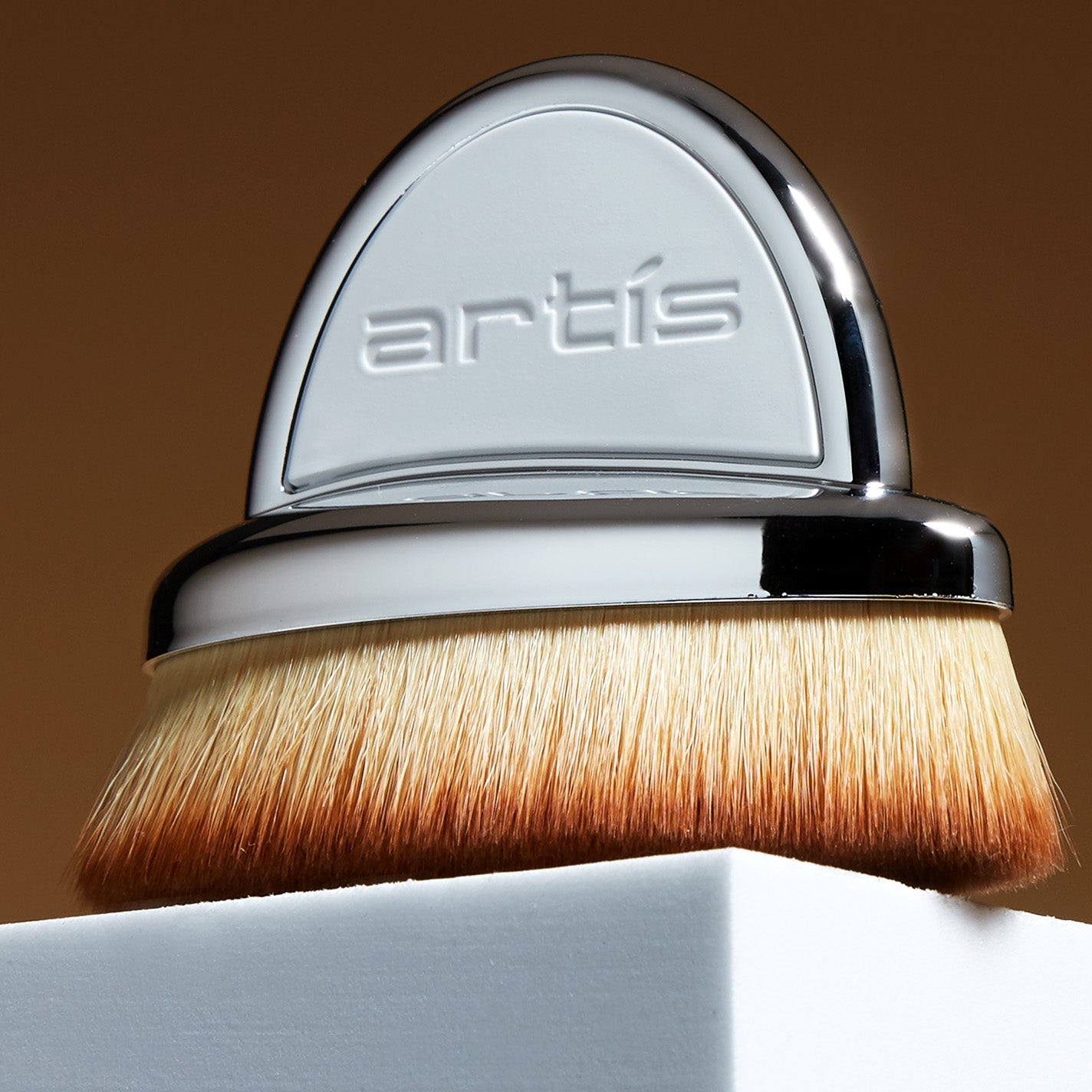 fini brush cosmetic on a pedestal