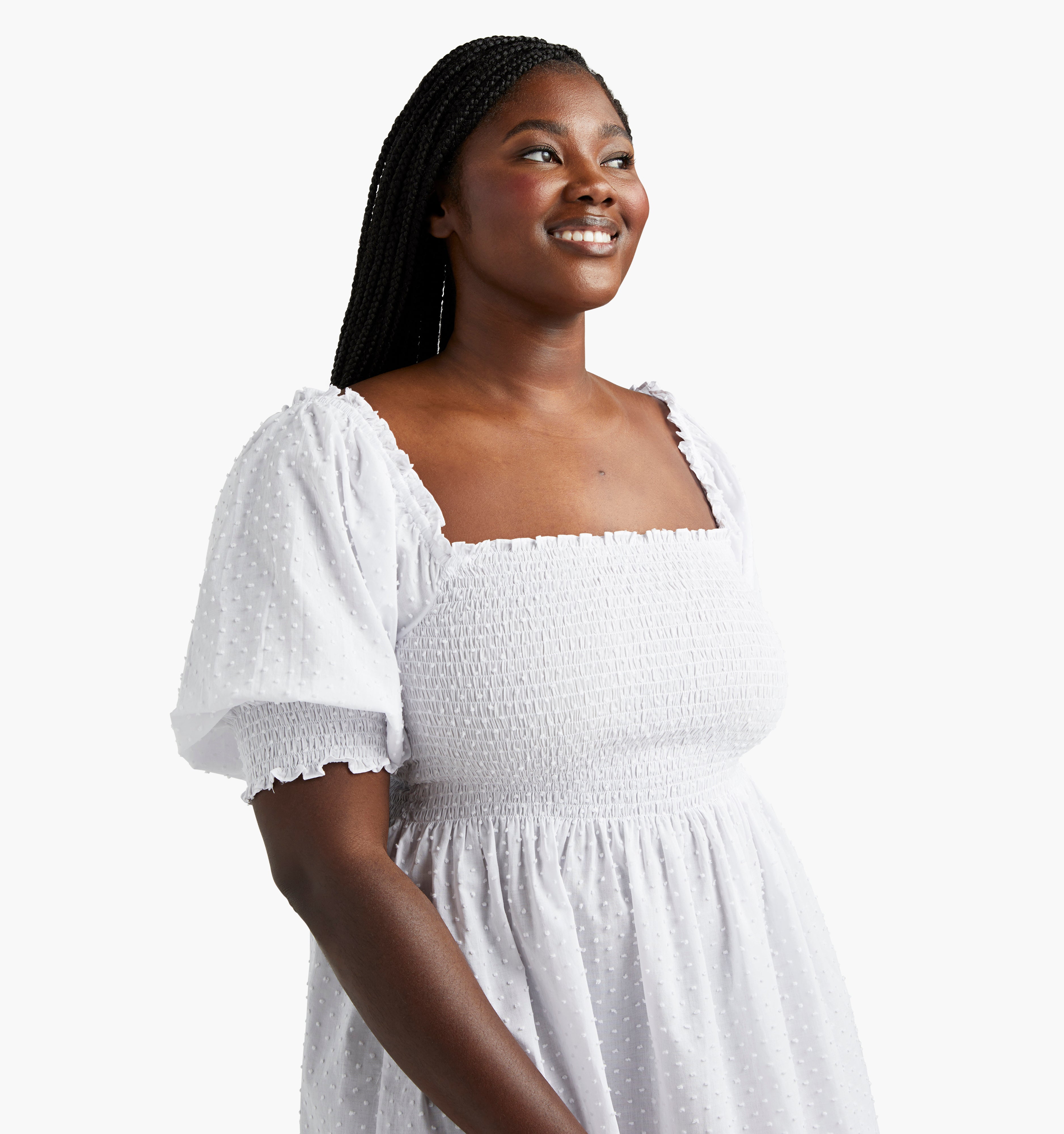 Na’Jeen is 5'9" and wears a size XS in the White Semi-Sheer Swiss Dot color:white semi-sheer swiss dot