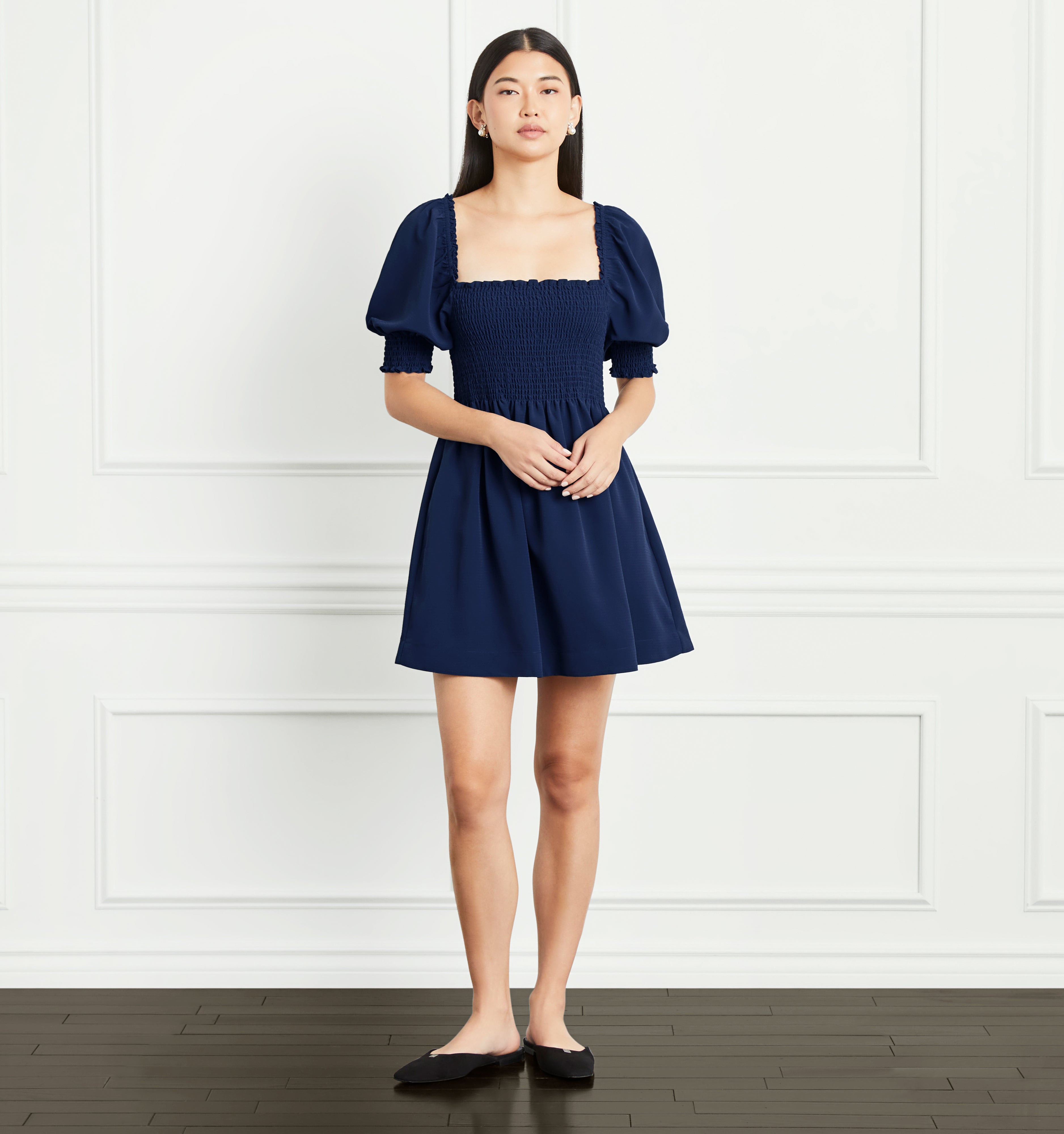 Sophia wears a size XS in the Navy Crepe color:Wrinkle Resistant Navy Crepe