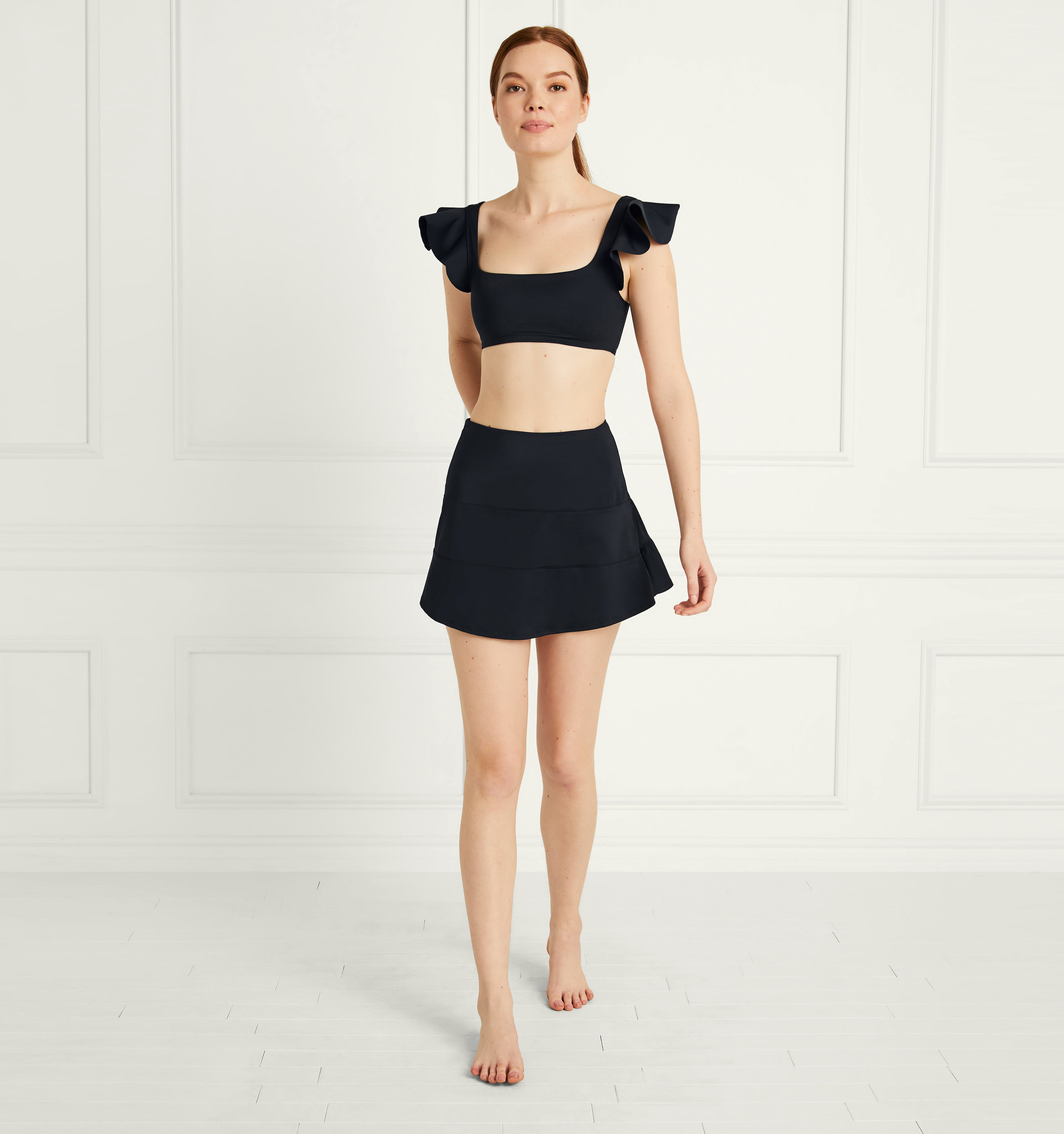 Anastasia wears and XS in the Black color:black 