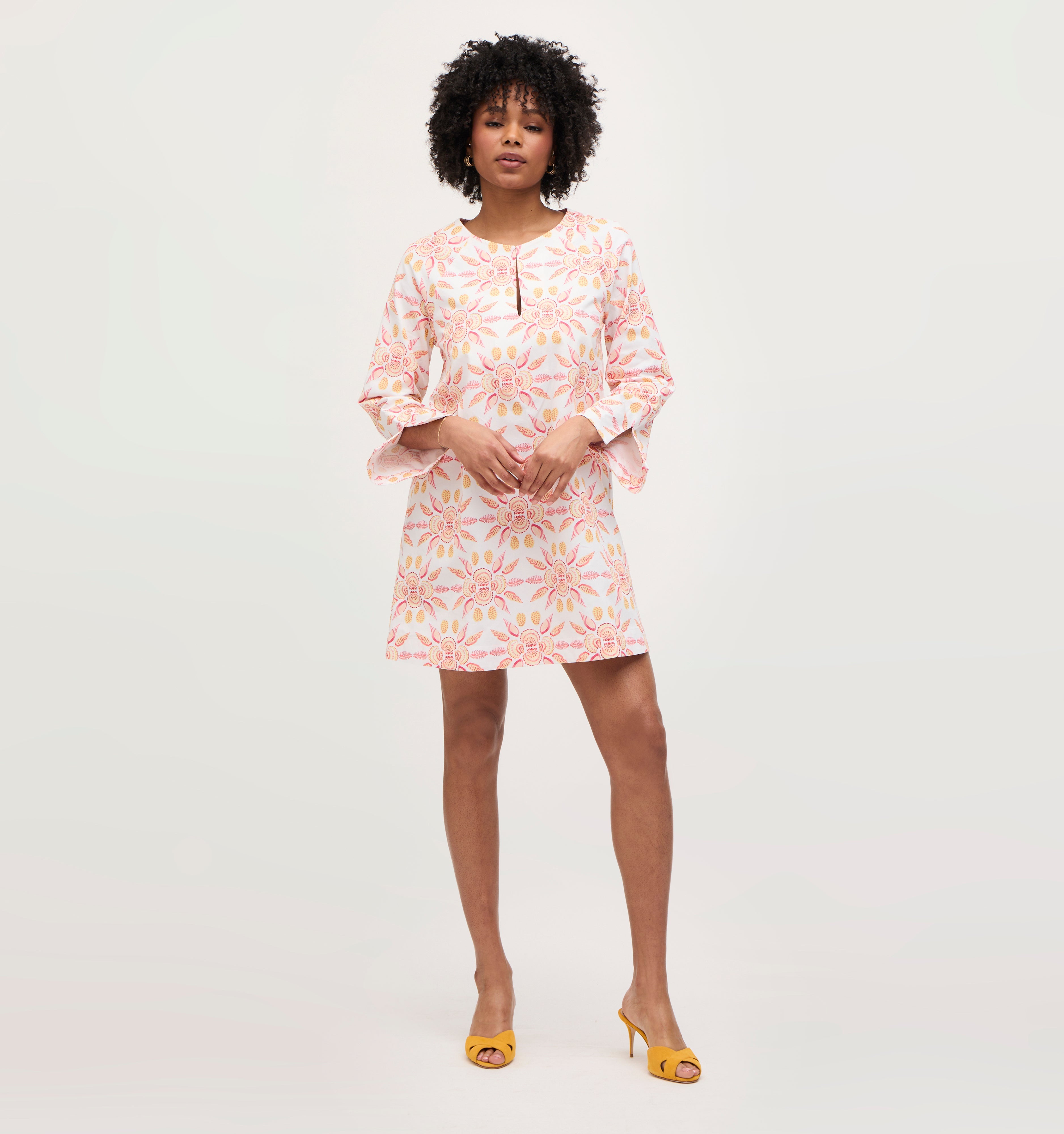 Na’Jeen wears a size S in the Orange Shell Mosaic Cotton color: Orange Shell Mosaic Cotton