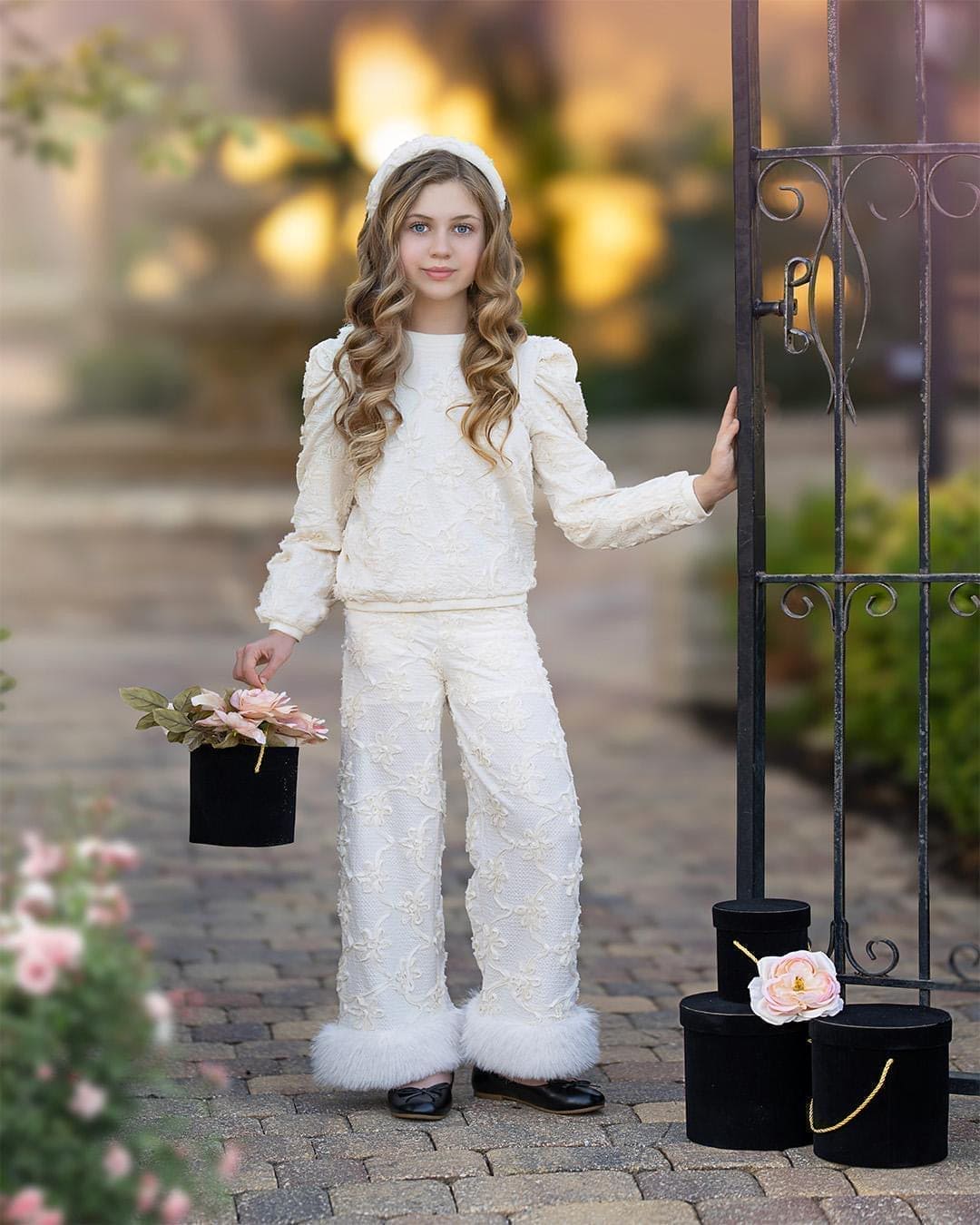 textured ivory floral sweater with slight puff on the sleeve. goes very well with any other pieces from the Ava collection