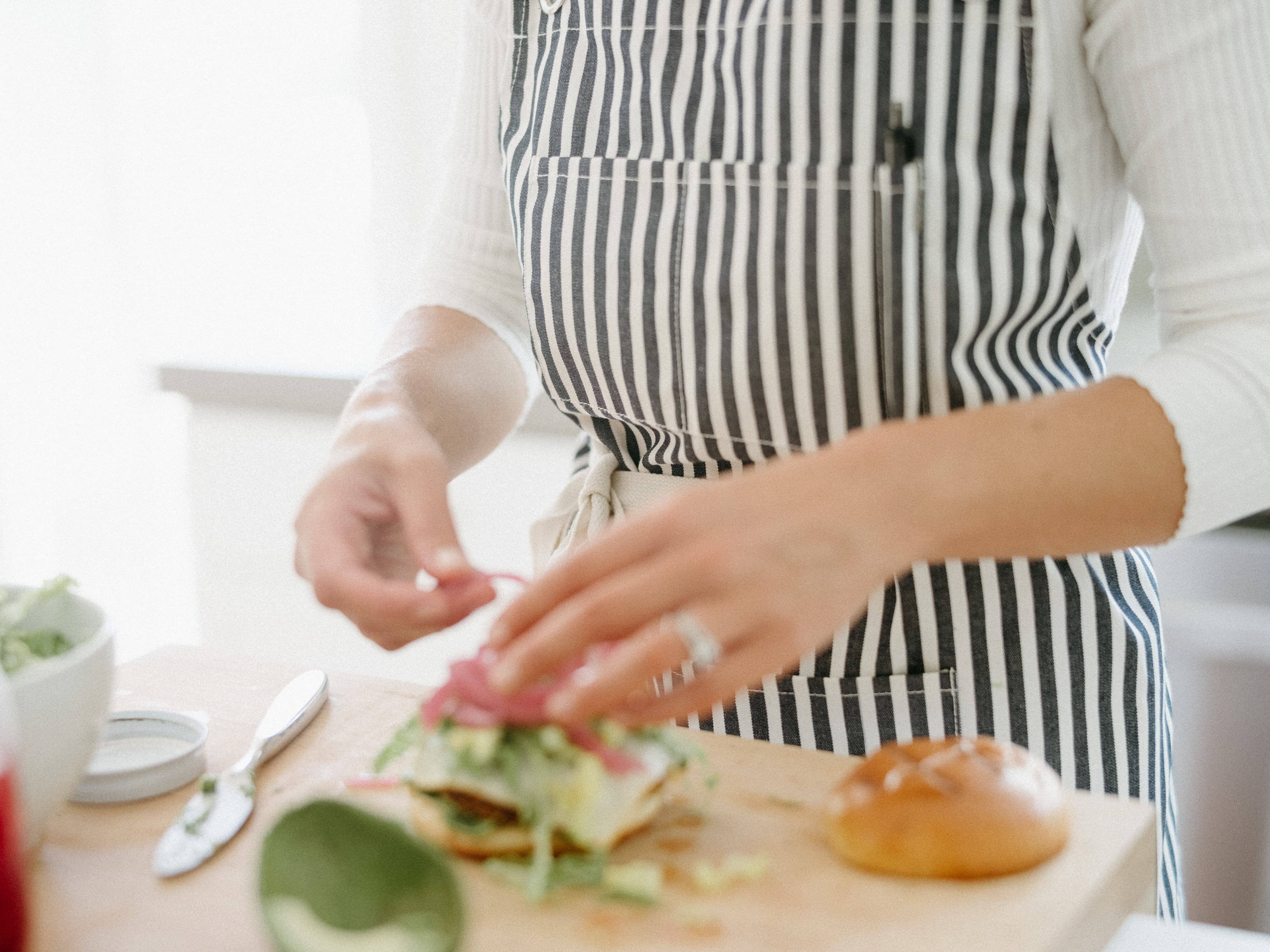 chef in the kitchen wearing navy apron