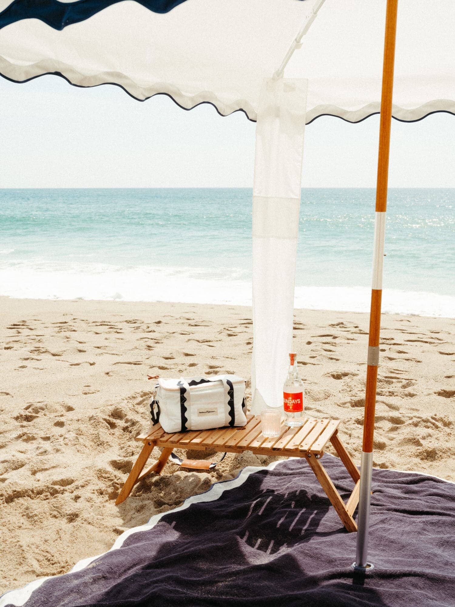 Riviera white cabana with matching accessories on the beach