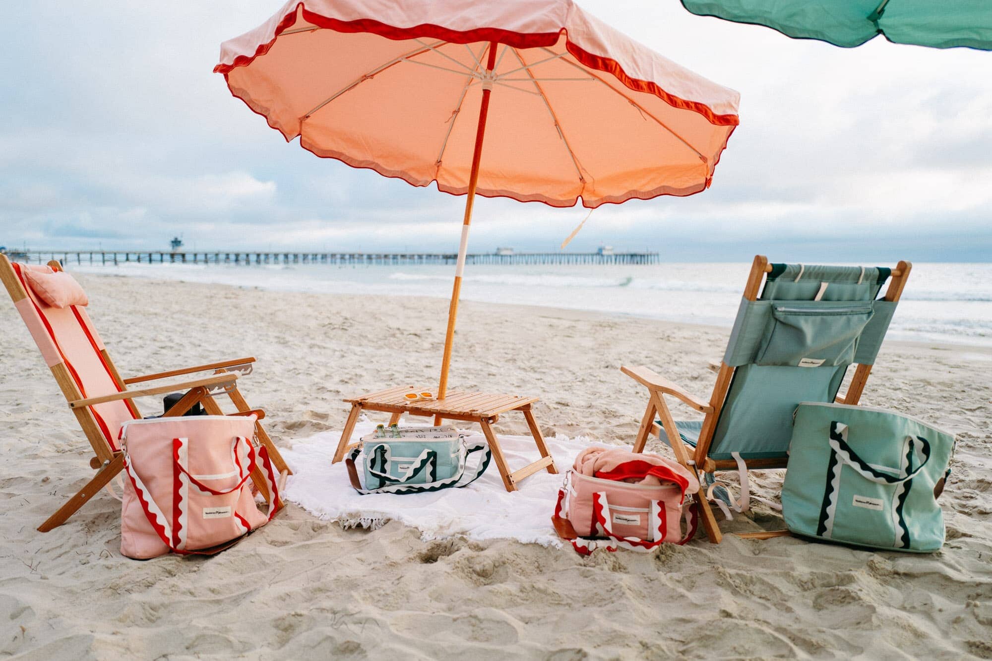 Rivie beach set up with umbrellas, chairs and coolers