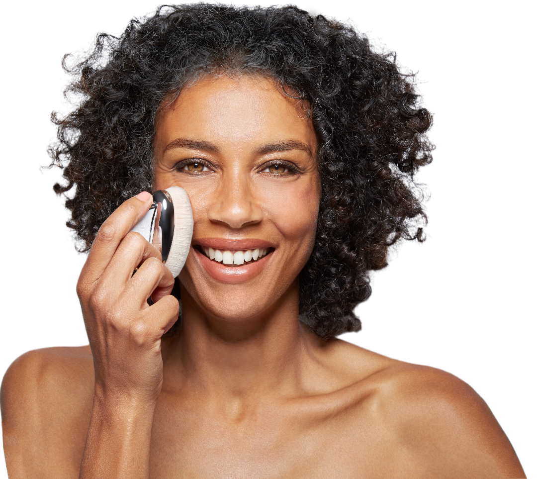 model holding fini brush skincare 2