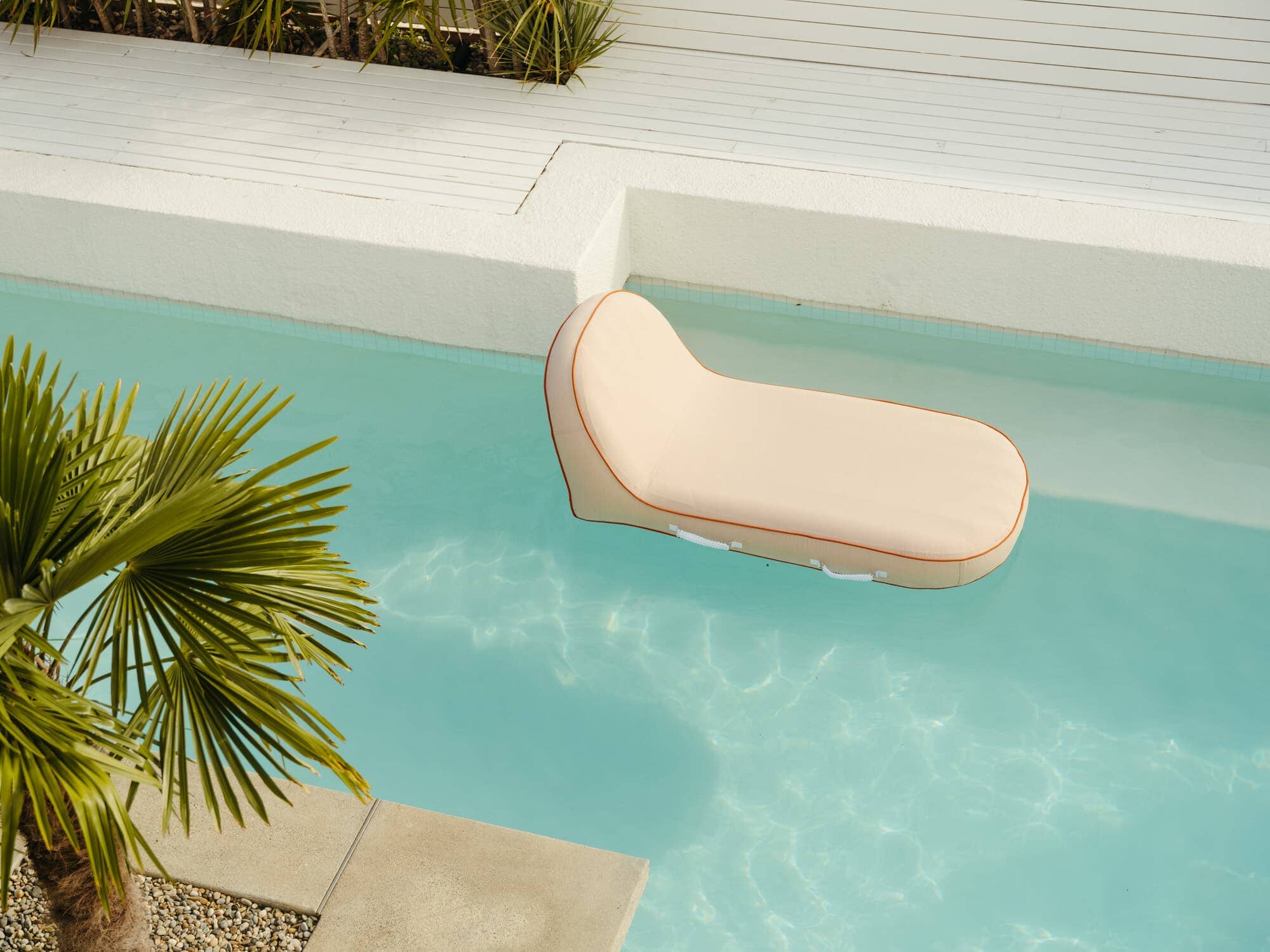 Riviera pink pool lounger in the pool