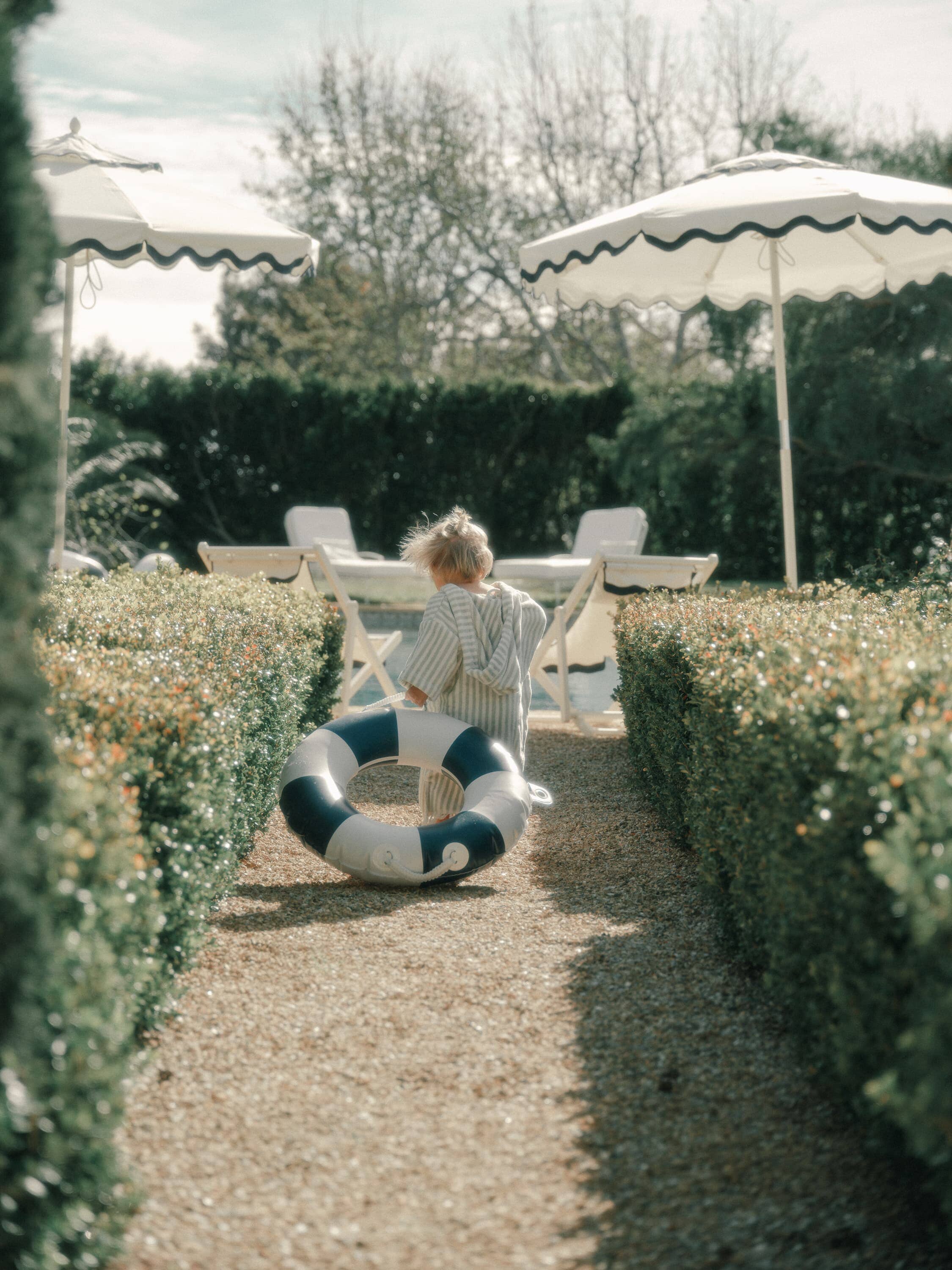 child with a navy pool ring