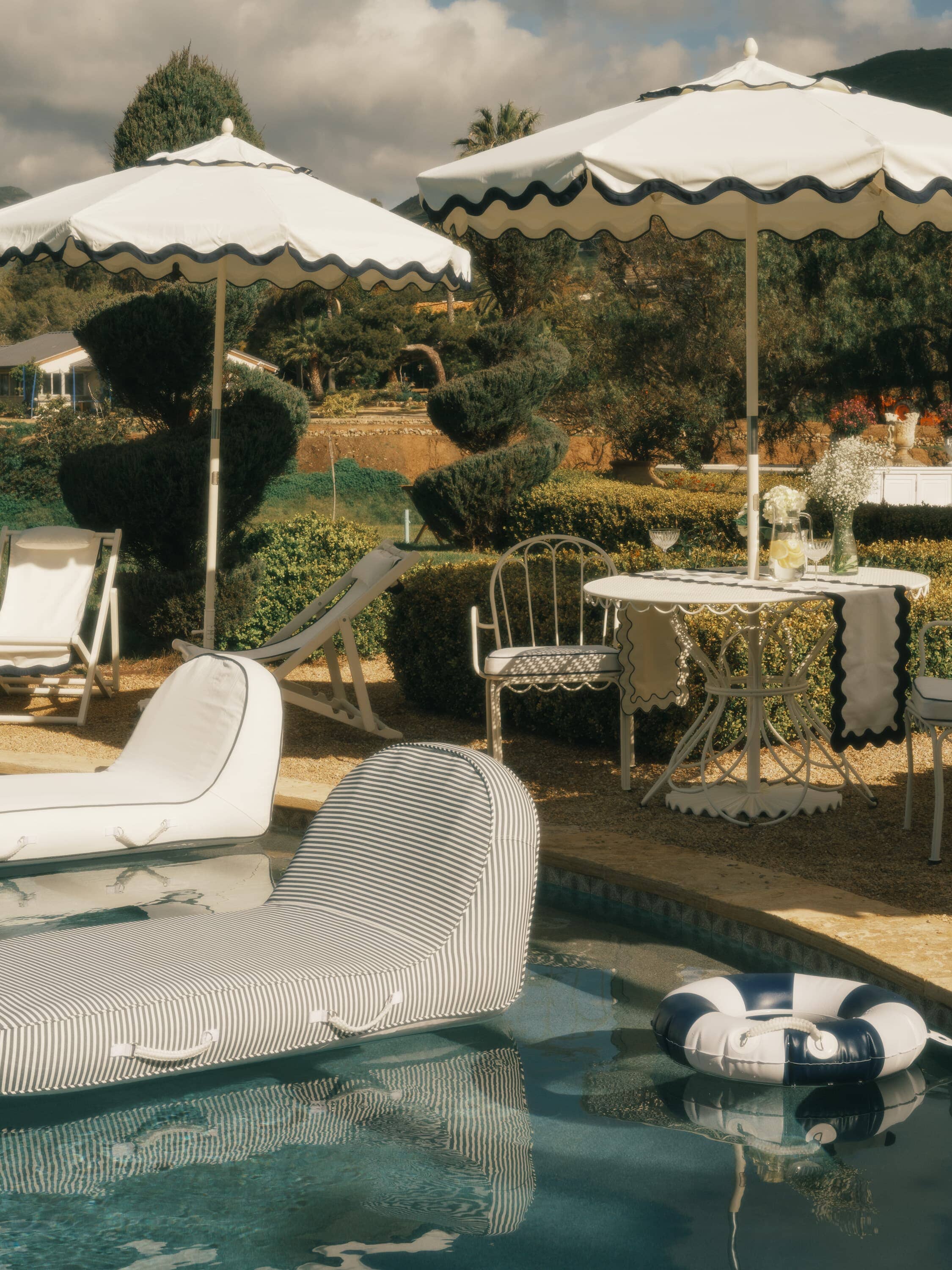 pool ring and pool loungers in a pool